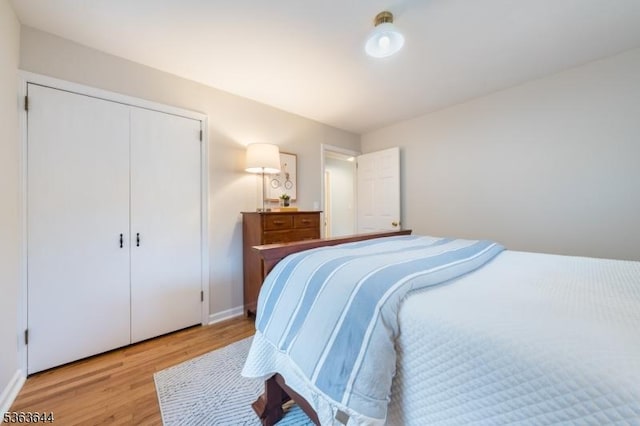 27 Brook Rd, New Providence Boro, NJ 07974 - bedroom with light wood-style flooring and a closet