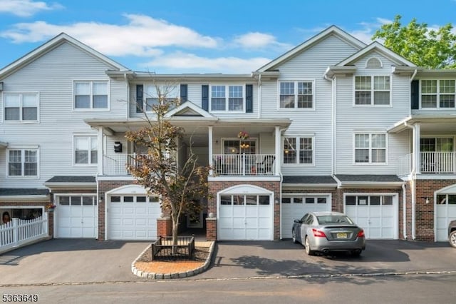 1111 Worthington Ct, Denville Twp, NJ 07834 - multi unit property featuring a garage, driveway, and brick siding
