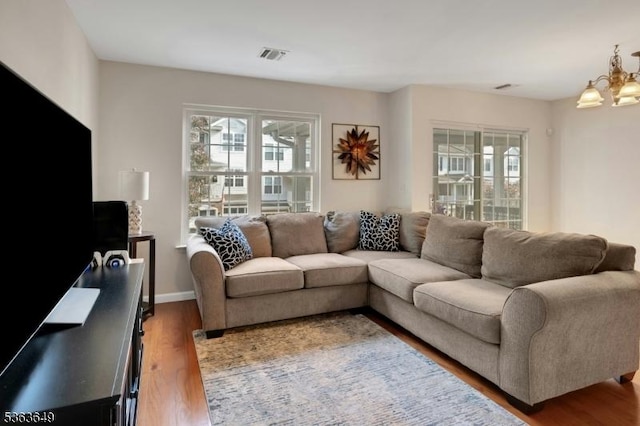 1111 Worthington Ct, Denville Twp, NJ 07834 - living room with wood finished floors and a chandelier