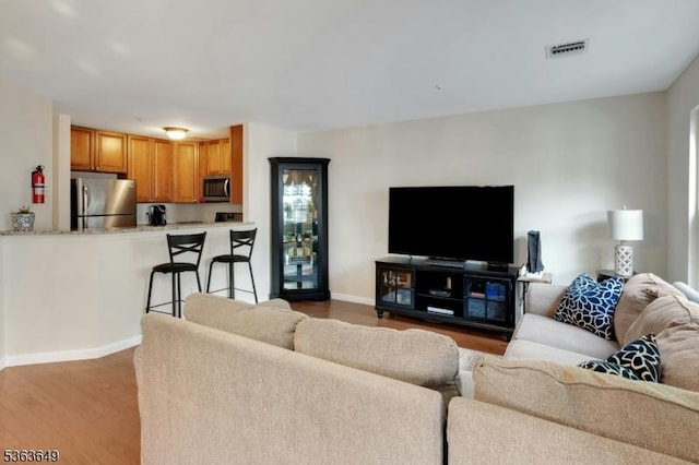 1111 Worthington Ct, Denville Twp, NJ 07834 - living room with wood finished floors and baseboards