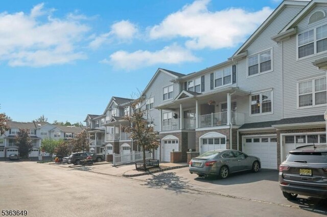 1111 Worthington Ct, Denville Twp, NJ 07834 - multi unit property with a residential view, driveway, and an attached garage