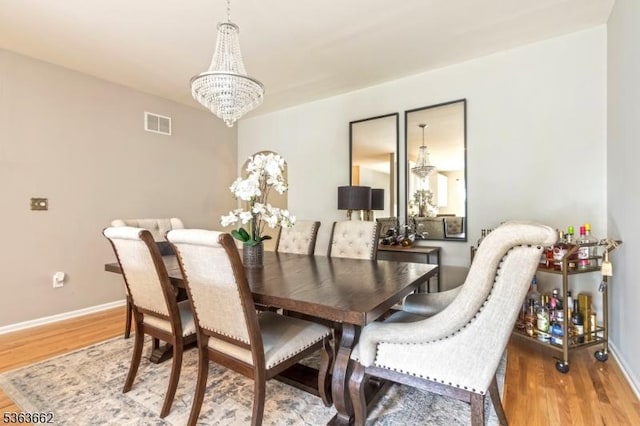 15 Fernwood Ct, Readington Twp, NJ 08889 - dining space with a chandelier and wood finished floors
