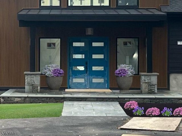 12 Rocky Point Rd, West Milford Twp, NJ 07421 - doorway to property with a standing seam roof, metal roof, and a porch