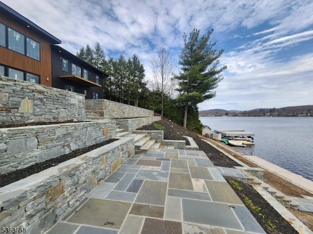 12 Rocky Point Rd, West Milford Twp, NJ 07421 - view of patio / terrace with a water view and a dock