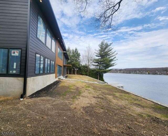 12 Rocky Point Rd, West Milford Twp, NJ 07421 - view of side of home featuring a water view