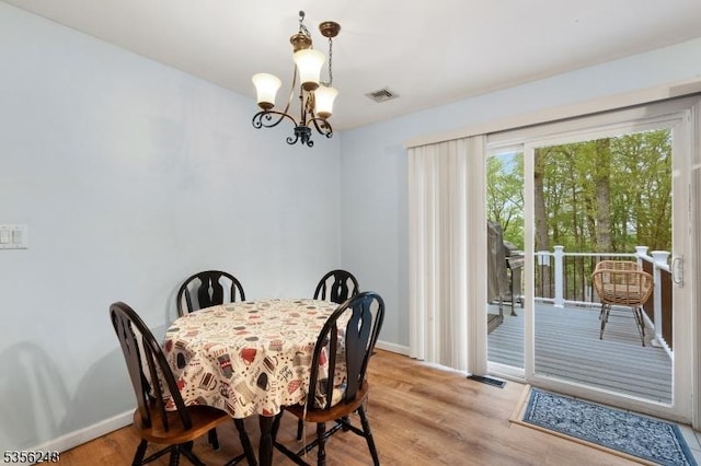 54 Stevens Trl, Hopatcong Boro, NJ 07843 - dining area featuring a chandelier, baseboards, and light wood-style floors