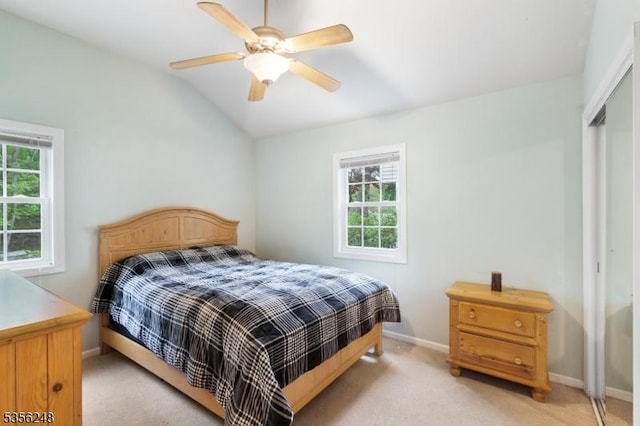 54 Stevens Trl, Hopatcong Boro, NJ 07843 - bedroom with a closet, multiple windows, light carpet, baseboards, and vaulted ceiling