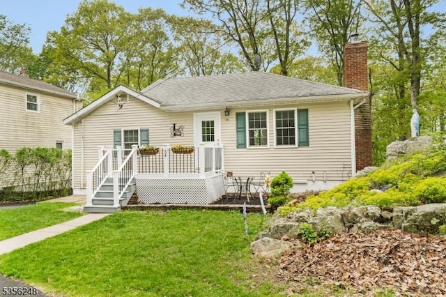 54 Stevens Trl, Hopatcong Boro, NJ 07843 - view of front of house with a chimney, a front lawn, and roof with shingles
