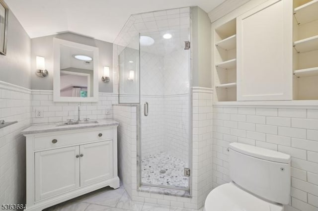 135 Weston Ave, Chatham Boro, NJ 07928 - bathroom with tile walls, vanity, a stall shower, and a wainscoted wall