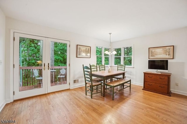 135 Weston Ave, Chatham Boro, NJ 07928 - dining area with light wood-type flooring, french doors, and a chandelier