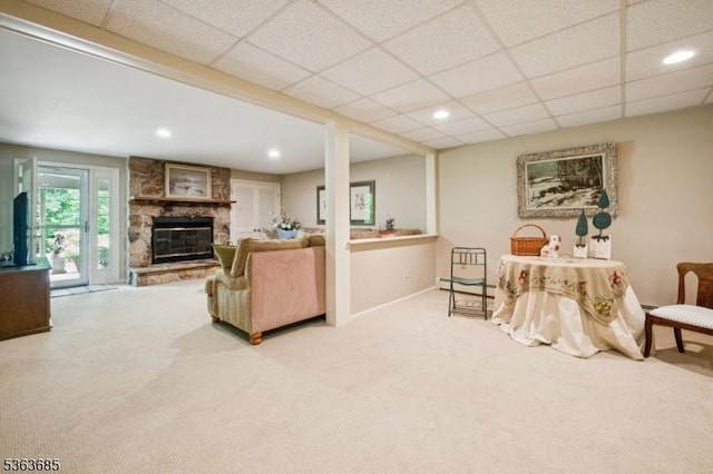 48 Dexter Dr N, Bernards Twp, NJ 07920 - living room with carpet flooring, a stone fireplace, a paneled ceiling, baseboard heating, and recessed lighting