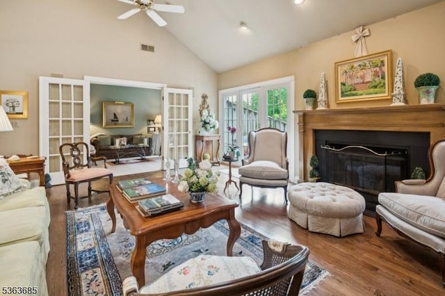 48 Dexter Dr N, Bernards Twp, NJ 07920 - living room with wood finished floors, high vaulted ceiling, a fireplace, a ceiling fan, and french doors