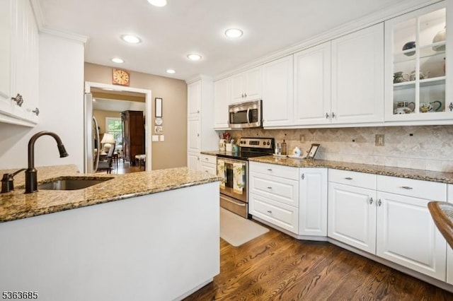 48 Dexter Dr N, Bernards Twp, NJ 07920 - kitchen featuring appliances with stainless steel finishes, white cabinets, light stone counters, dark wood finished floors, and decorative backsplash