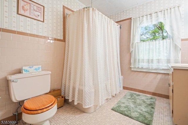6 Penn Ave, Andover Twp, NJ 07860 - full bathroom featuring wallpapered walls, tile walls, vanity, wainscoting, and a shower with curtain
