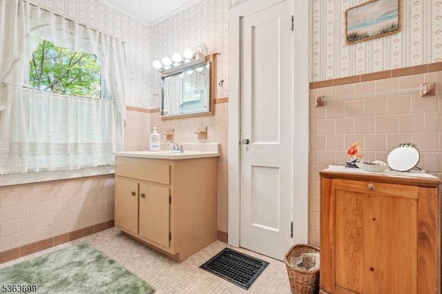 6 Penn Ave, Andover Twp, NJ 07860 - bathroom with wallpapered walls, tile walls, vanity, tile patterned floors, and wainscoting