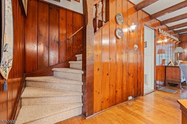 6 Penn Ave, Andover Twp, NJ 07860 - stairs featuring wood walls, wood finished floors, and beam ceiling