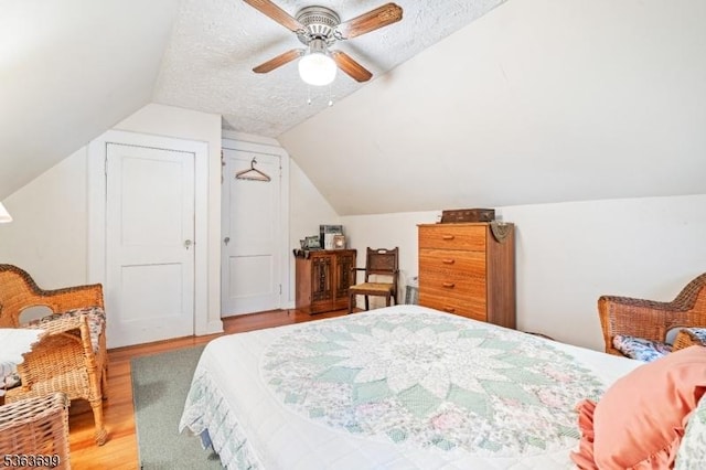 6 Penn Ave, Andover Twp, NJ 07860 - bedroom featuring light wood-style flooring, vaulted ceiling, ceiling fan, and a textured ceiling