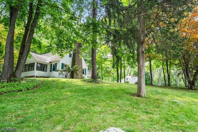 6 Penn Ave, Andover Twp, NJ 07860 - view of green lawn featuring a sunroom