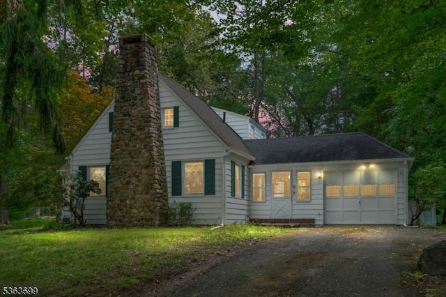 6 Penn Ave, Andover Twp, NJ 07860 - view of front of property with an attached garage, a chimney, and driveway