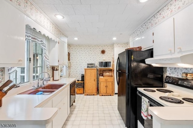 6 Penn Ave, Andover Twp, NJ 07860 - kitchen featuring wallpapered walls, electric stove, under cabinet range hood, light countertops, and white cabinets