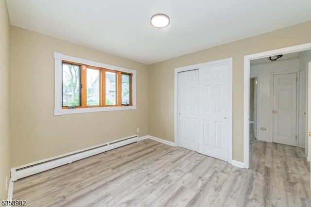 65 Beechwood Ave, Parsippany-Troy Hills Twp, NJ 07034 - unfurnished bedroom with a baseboard radiator, wood finished floors, and a closet