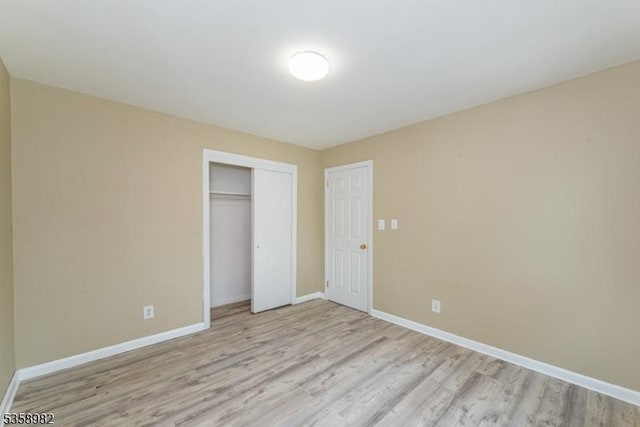 65 Beechwood Ave, Parsippany-Troy Hills Twp, NJ 07034 - unfurnished bedroom with light wood-style flooring and a closet