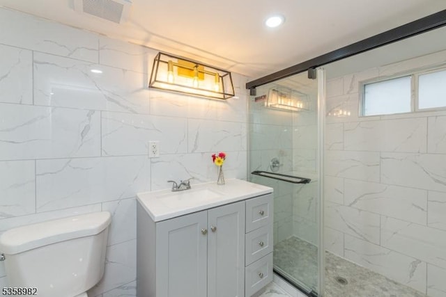65 Beechwood Ave, Parsippany-Troy Hills Twp, NJ 07034 - bathroom featuring a stall shower, vanity, tile walls, and recessed lighting