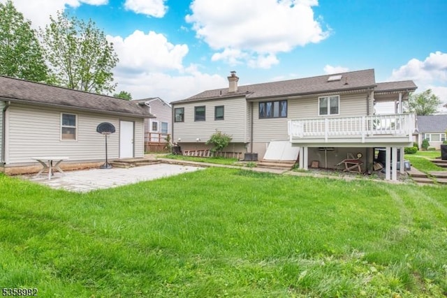 65 Beechwood Ave, Parsippany-Troy Hills Twp, NJ 07034 - back of house with a deck, a yard, a chimney, and a patio