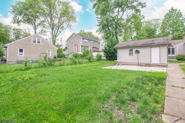 65 Beechwood Ave, Parsippany-Troy Hills Twp, NJ 07034 - view of yard featuring a residential view, an outdoor structure, and a patio