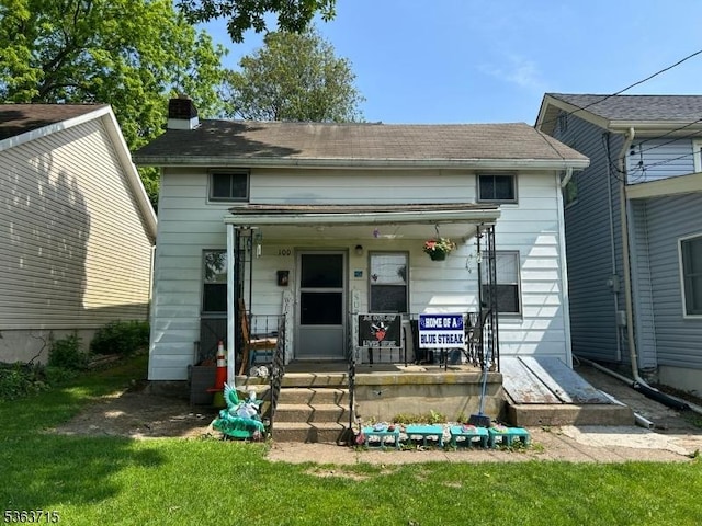 100 Myrtle Ave, Washington Boro, NJ 07882 - view of front of house featuring covered porch, a chimney, and a front lawn