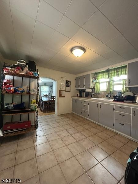100 Myrtle Ave, Washington Boro, NJ 07882 - kitchen with arched walkways, light tile patterned floors, and light countertops