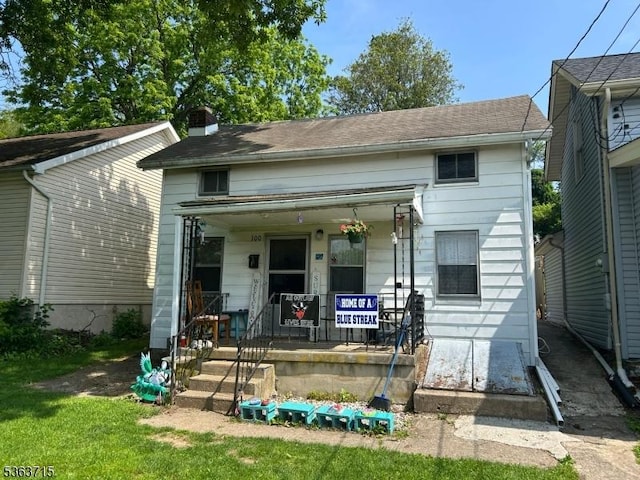 100 Myrtle Ave, Washington Boro, NJ 07882 - shotgun-style home with a porch and a chimney