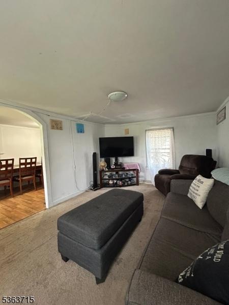 100 Myrtle Ave, Washington Boro, NJ 07882 - carpeted living room featuring arched walkways
