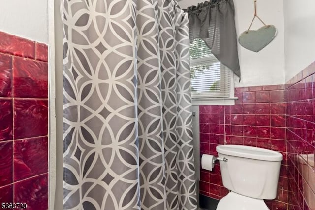 411 S 2nd St, Lopatcong Twp, NJ 08865 - full bathroom with tile walls, curtained shower, and toilet