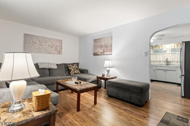 411 S 2nd St, Lopatcong Twp, NJ 08865 - living area featuring wood finished floors and arched walkways