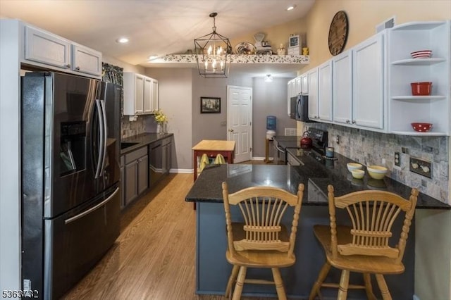 130 Lake Iliff Rd, Andover Twp, NJ 07860 - kitchen with refrigerator with ice dispenser, electric range oven, black microwave, dishwasher, and backsplash