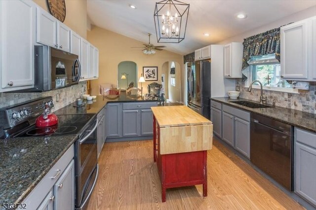 130 Lake Iliff Rd, Andover Twp, NJ 07860 - kitchen featuring stainless steel appliances, lofted ceiling, light wood-style flooring, ceiling fan, and arched walkways