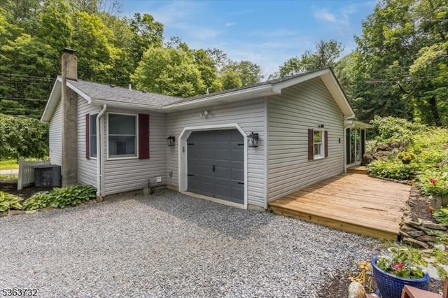 130 Lake Iliff Rd, Andover Twp, NJ 07860 - view of side of property featuring an attached garage, a chimney, and gravel driveway