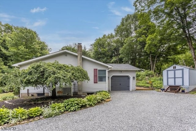 130 Lake Iliff Rd, Andover Twp, NJ 07860 - view of home's exterior featuring an attached garage, a storage shed, driveway, and view of scattered trees