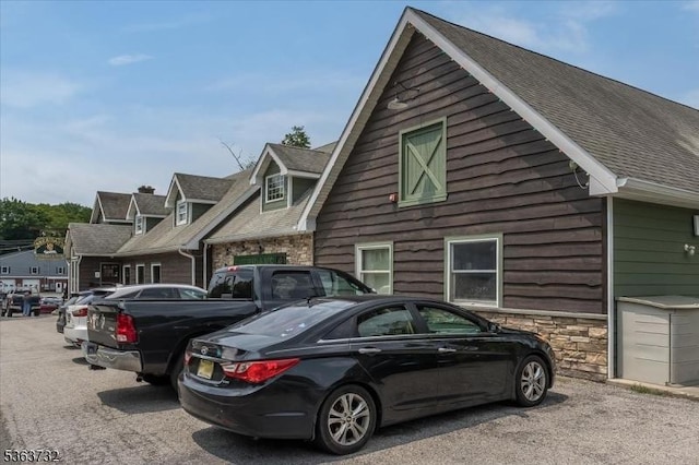 130 Lake Iliff Rd, Andover Twp, NJ 07860 - view of side of property with stone siding and a shingled roof