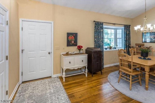 130 Lake Iliff Rd, Andover Twp, NJ 07860 - dining area with a chandelier, wood finished floors, and lofted ceiling