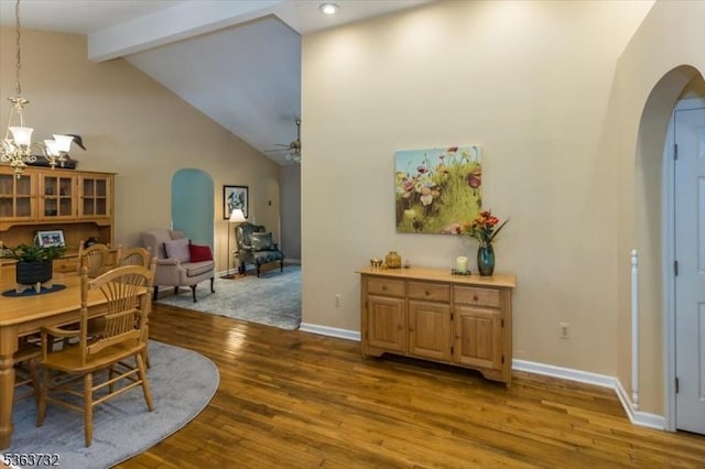 130 Lake Iliff Rd, Andover Twp, NJ 07860 - dining room featuring arched walkways, a ceiling fan, beamed ceiling, wood finished floors, and high vaulted ceiling