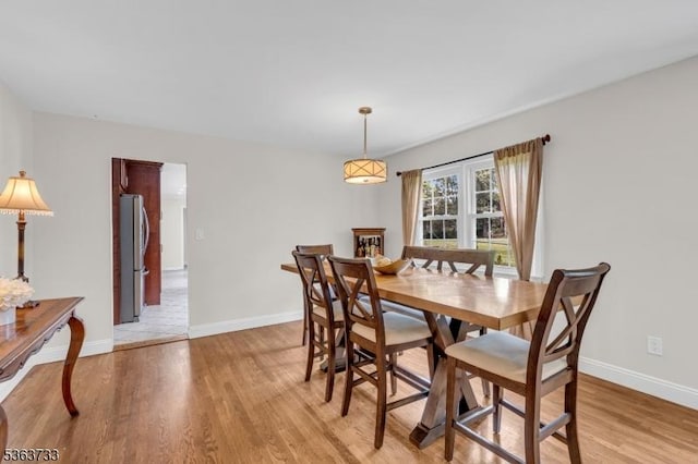 750 Saint Georges Rd, Bridgewater Twp, NJ 08807 - dining room with light wood-type flooring and baseboards