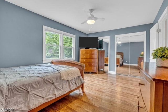 750 Saint Georges Rd, Bridgewater Twp, NJ 08807 - bedroom with light wood-style floors, ceiling fan, and multiple closets