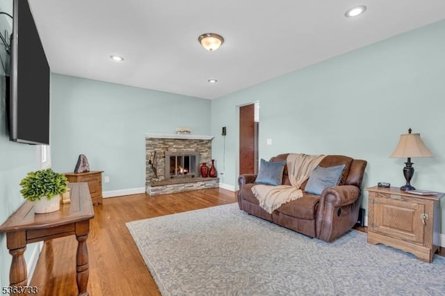 750 Saint Georges Rd, Bridgewater Twp, NJ 08807 - living room with wood finished floors, a stone fireplace, and recessed lighting