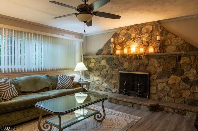 127 Walnut Ave, Franklin Twp, NJ 08873 - living area featuring wood finished floors, ceiling fan, a stone fireplace, and crown molding