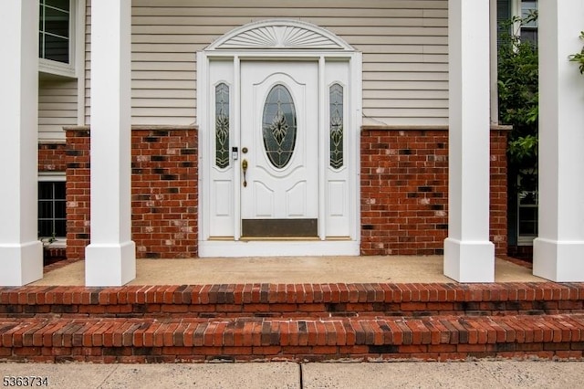 127 Walnut Ave, Franklin Twp, NJ 08873 - doorway to property with brick siding and a porch