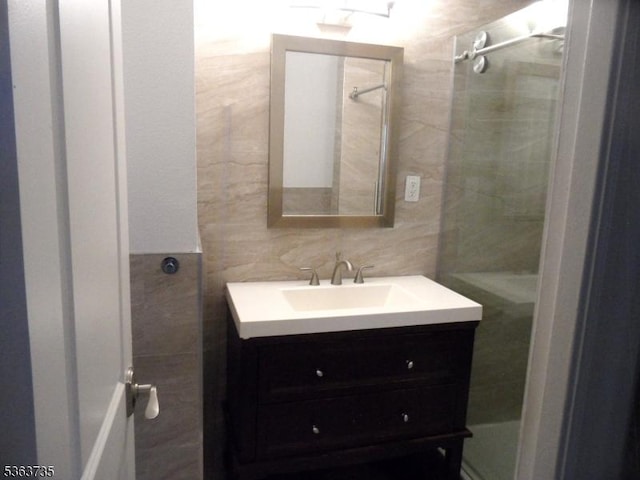 276 Prospect St, East Orange City, NJ 07017 - bathroom with tile walls, vanity, and a shower