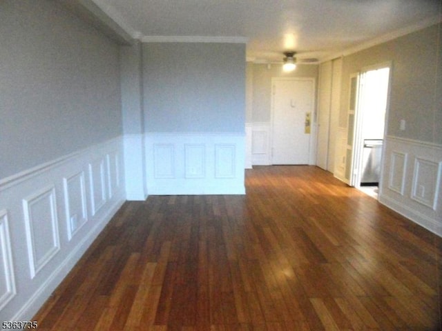 276 Prospect St, East Orange City, NJ 07017 - spare room featuring a decorative wall, ornamental molding, a wainscoted wall, dark wood-type flooring, and ceiling fan