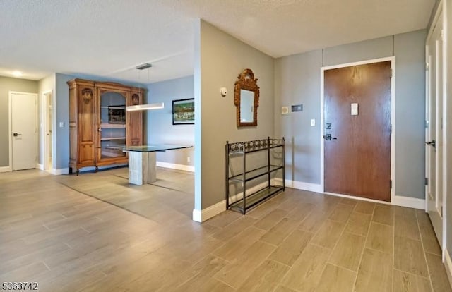 2 Claridge Dr Unit 7Ke, Verona Twp, NJ 07044 - foyer entrance featuring light wood-style flooring and a textured ceiling